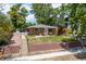 Charming brick home with well-maintained landscaping and a cozy front porch at 2217 King St, Denver, CO 80211