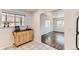 Kitchen featuring a moveable island, tile flooring, and an arched entryway to another room at 2217 King St, Denver, CO 80211