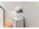 This functional laundry room boasts a washer and dryer, and plenty of storage at 2217 King St, Denver, CO 80211