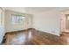 Bright living room with hardwood floors, a bright window, and minimalist design at 2217 King St, Denver, CO 80211