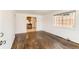 Spacious living room with hardwood floors, a bright window, and minimalist design at 2217 King St, Denver, CO 80211