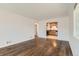 Bright, spacious living room features gleaming hardwood floors and seamlessly connects to the kitchen at 2217 King St, Denver, CO 80211