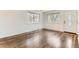 Bright living room features hardwood floors, large windows, and a view of the outdoors at 2217 King St, Denver, CO 80211