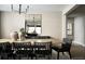 Bright dining room with a large table, modern lighting, and neutral decor at 23738 E 42Nd Ave, Aurora, CO 80019