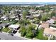 Aerial view showcasing the neighborhood with mature trees, well-maintained lawns, and surrounding residential properties at 10769 Carrol Ln, Northglenn, CO 80233
