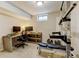 Finished basement featuring a home office and workout area with weightlifting equipment and space for exercise at 10769 Carrol Ln, Northglenn, CO 80233