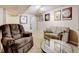 Cozy basement living area with comfortable seating and neutral carpet at 10769 Carrol Ln, Northglenn, CO 80233