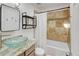 Stylish bathroom with glass vessel sink, granite countertops, and tiled shower at 10769 Carrol Ln, Northglenn, CO 80233