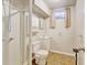 Bathroom featuring a walk-in shower, toilet, vanity and a neutral color palette at 10769 Carrol Ln, Northglenn, CO 80233