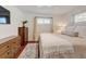 Comfortable bedroom with neutral tones, two windows and ample natural light at 10769 Carrol Ln, Northglenn, CO 80233