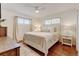 Serene bedroom features natural light, ceiling fan, and neutral decor at 10769 Carrol Ln, Northglenn, CO 80233