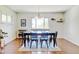 Elegant dining room with hardwood floors and a large window providing natural light at 10769 Carrol Ln, Northglenn, CO 80233