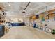 Bright and spacious garage featuring ample storage, a work bench, and lots of potential for projects at 10769 Carrol Ln, Northglenn, CO 80233