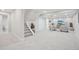 Finished basement area features a staircase and a cozy sitting area with a TV at 9805 Keenan St, Highlands Ranch, CO 80130