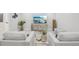 Bright basement lounge area features modern furnishings and a flat screen TV at 9805 Keenan St, Highlands Ranch, CO 80130