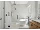 The modern bathroom features a glass shower, soaking tub, and sleek design, creating a spa-like experience at 9805 Keenan St, Highlands Ranch, CO 80130