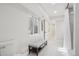 Finished basement bathroom featuring a bench, tiled floor, and modern fixtures at 9805 Keenan St, Highlands Ranch, CO 80130
