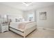 The bedroom is bathed in natural light and features a window and is decorated with calming, neutral tones at 9805 Keenan St, Highlands Ranch, CO 80130