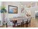 Formal dining room featuring modern lighting, a staircase to the second level, and elegant decor at 9805 Keenan St, Highlands Ranch, CO 80130