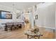 Spacious dining area with an open floor plan, modern lighting, and staircase leading to upper level at 9805 Keenan St, Highlands Ranch, CO 80130