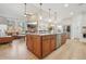 Open concept kitchen features a large island, stainless steel appliances, and a seamless transition to the living area at 9805 Keenan St, Highlands Ranch, CO 80130