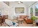 Comfortable living room offers ample natural light and view into kitchen at 9805 Keenan St, Highlands Ranch, CO 80130
