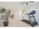 Open loft space with a treadmill and view of the staircase, perfect for a home gym or recreation area at 9805 Keenan St, Highlands Ranch, CO 80130