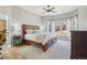Serene main bedroom featuring a large window, hardwood floors, and neutral decor at 9805 Keenan St, Highlands Ranch, CO 80130