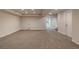 Unfurnished basement space with neutral walls and carpet flooring, and an exit to the outside at 10272 Greenfield Cir, Parker, CO 80134