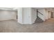 Finished basement area with carpet flooring and stairway and access to other areas at 10272 Greenfield Cir, Parker, CO 80134