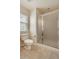 Bathroom showcasing tiled floor, a white toilet, and glass enclosed shower at 10272 Greenfield Cir, Parker, CO 80134