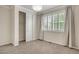 Bedroom featuring plush carpet, window with blinds, and closet space at 10272 Greenfield Cir, Parker, CO 80134