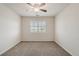 Bedroom with a ceiling fan, a window with blinds, and neutral carpet at 10272 Greenfield Cir, Parker, CO 80134