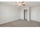 A neutral bedroom featuring plush carpet and white closet door at 10272 Greenfield Cir, Parker, CO 80134