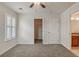 Neutral bedroom with carpet, ceiling fan, and white closet door at 10272 Greenfield Cir, Parker, CO 80134