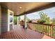 Spacious deck with wood railings and beautiful landscaping views at 10272 Greenfield Cir, Parker, CO 80134