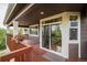 Inviting deck with flower boxes, a sliding glass door and a pet door for easy access to the backyard at 10272 Greenfield Cir, Parker, CO 80134