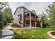 Exterior view of the back of the home with a walkout basement and second story deck at 10272 Greenfield Cir, Parker, CO 80134