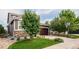 Exterior shot of house with stone and siding and a large garage at 10272 Greenfield Cir, Parker, CO 80134