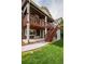 Rear exterior view of home featuring deck, patio, and grassy lawn at 10272 Greenfield Cir, Parker, CO 80134