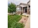 Close up of the house and front yard with beautiful landscaping and stone accents at 10272 Greenfield Cir, Parker, CO 80134