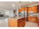 Modern kitchen features an island with granite countertops and stainless steel appliances at 10272 Greenfield Cir, Parker, CO 80134