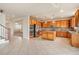Bright kitchen features light-colored cabinets, granite countertops, stainless steel appliances and tile floors at 10272 Greenfield Cir, Parker, CO 80134