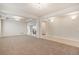 Spacious living room featuring an open layout, plush carpet, and decorative lighting at 10272 Greenfield Cir, Parker, CO 80134