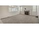 Cozy living room with carpet, fireplace, mantle, recessed lights, and shuttered windows at 10272 Greenfield Cir, Parker, CO 80134