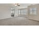Spacious main bedroom with neutral carpet and many windows offering ample natural light at 10272 Greenfield Cir, Parker, CO 80134
