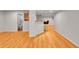 Finished basement with wood floors, bar seating, and bathroom access at 5906 S Youngfield Way, Littleton, CO 80127