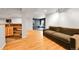 Spacious finished basement with wood floors, wet bar, and comfortable seating area at 5906 S Youngfield Way, Littleton, CO 80127