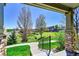 Landscaped front yard with stone porch columns and lush green grass at 5906 S Youngfield Way, Littleton, CO 80127