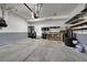 Clean two-car garage with ample lighting and built-in shelving for storage at 5906 S Youngfield Way, Littleton, CO 80127